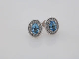 14K White 7x5 mm Natural Aquamarine 1/6 CTW Natural Diamond Halo-Style Earrings
